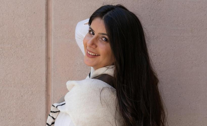 Woman Wearing Sweater Tied Around her Shoulders Even Though She Doesn’t Have a Bloodstain up There