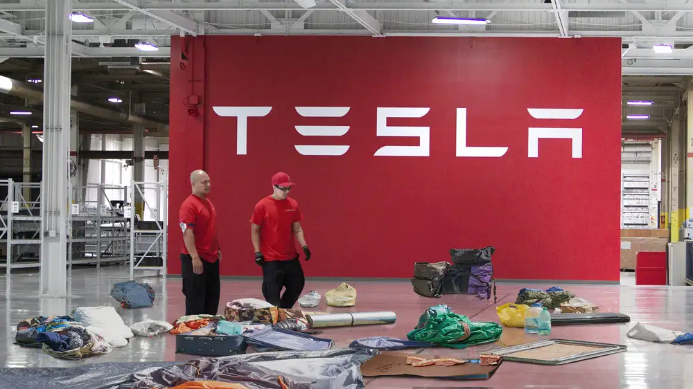 Tesla Employees Scramble To Make Office Look Like They’ve Been Sleeping There