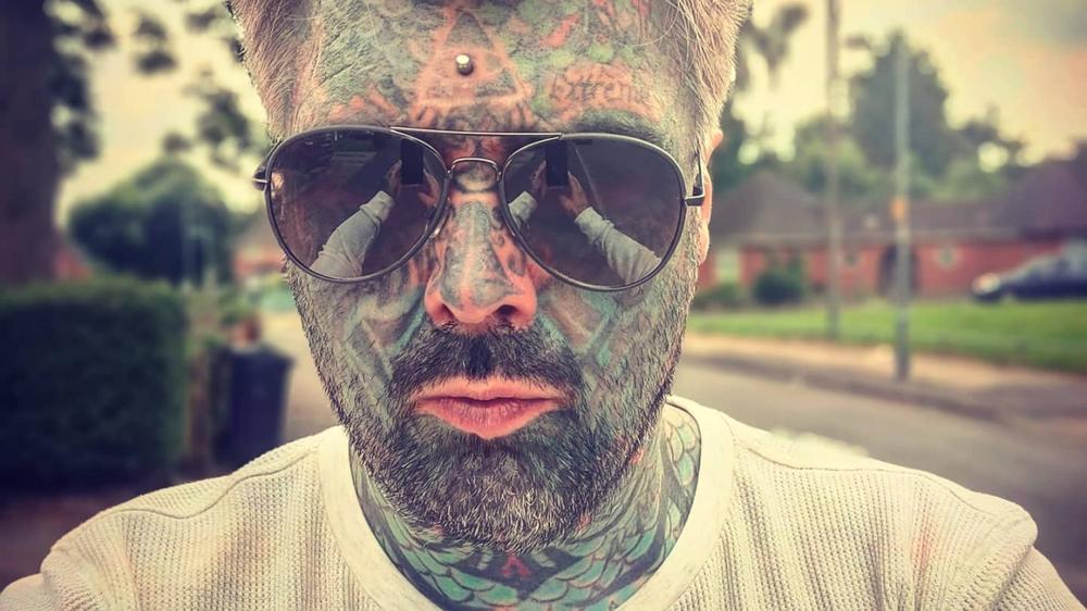 Britain’s most tattooed man says UK’s age check system told him to “remove his face”