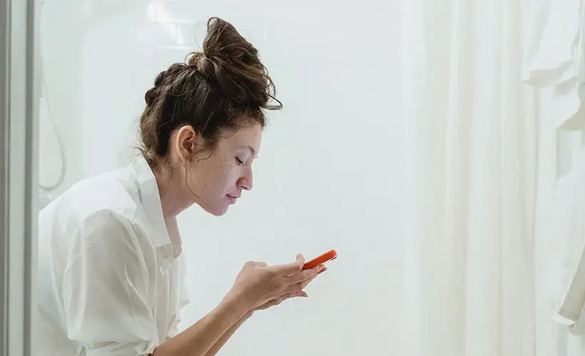 Woman Takes Invigorating Break From Using Phone on Couch to Use Phone on Toilet