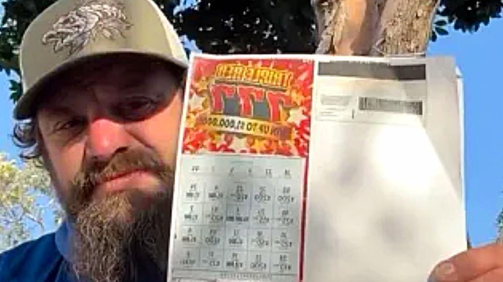 Homeless man wins $1 million from scratch card he thought was only $200