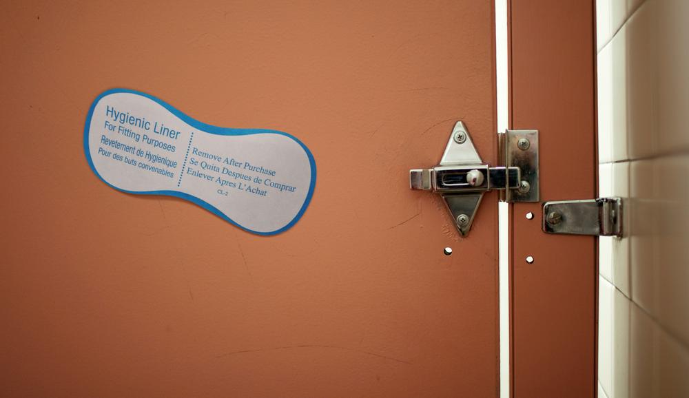 Swimsuit Hygienic Liner Slapped Onto Beach Bathroom Stall