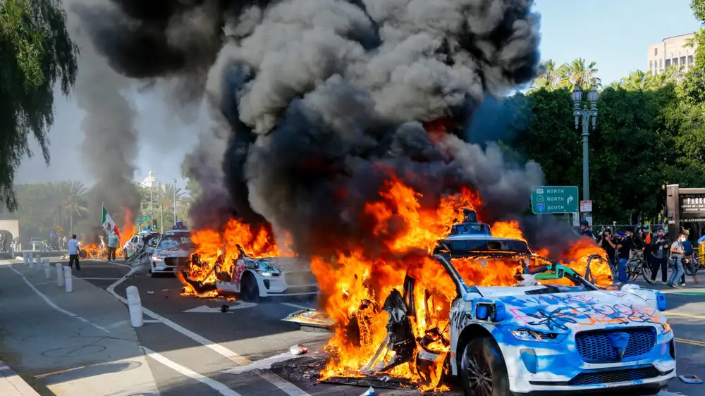 Protesters summon, burn Waymo robotaxis in Los Angeles after ICE raids