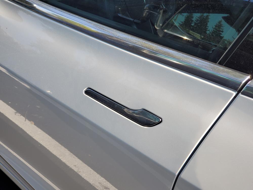 Tesla under investigation for door handles that trap people inside