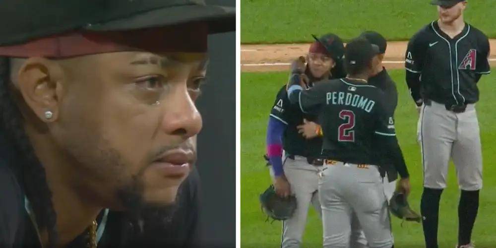 Arizona Diamondbacks player Ketel Marte consoled by teammates on the field after fan mocks his deceased mother